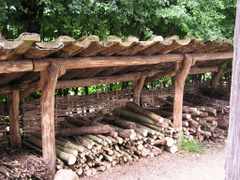 The mono-pitch shed roof to this firewood shed keeps the rain off and 