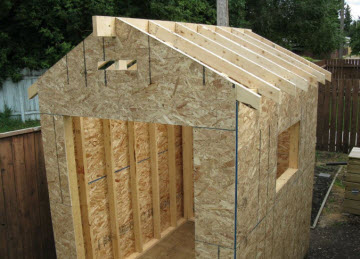 Structure of shed roof in place. Roof is supported on a central ridge    