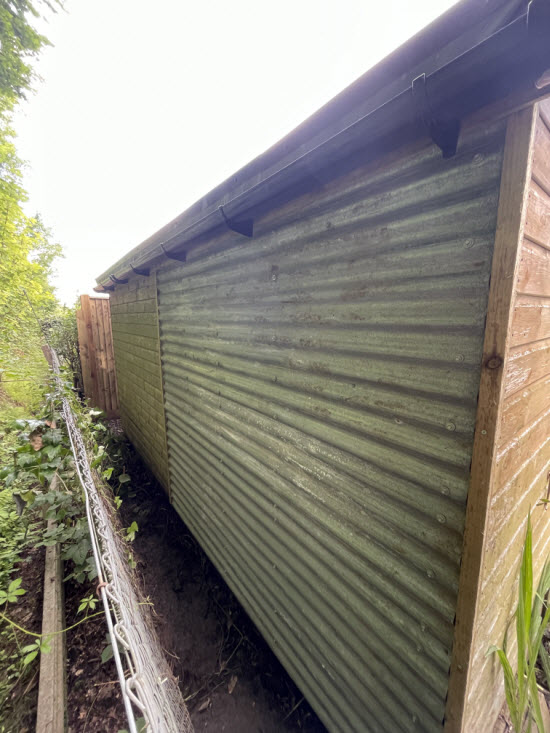 shed cladding repair with corrugations running horizontally