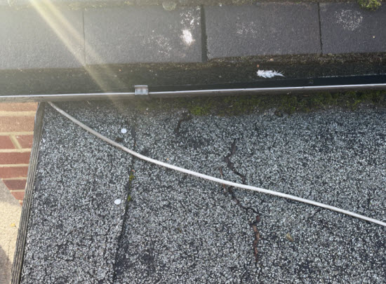 A tear in a shed roof felt roof covering